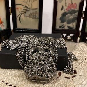Silver Tone Purse Necklace. Opens Up. Very long chains.
